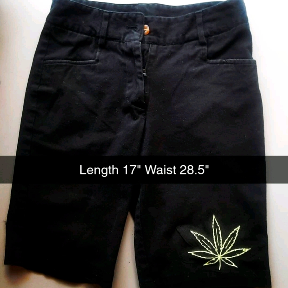 Black shorts with flower patch
